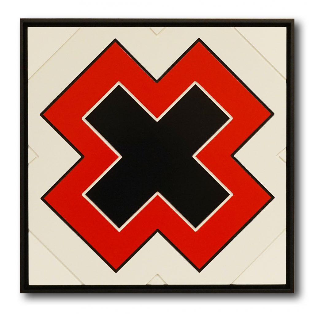 The letter X, carved and painted wood, with red, black and white