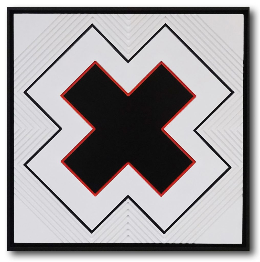 The letter X carved into wood, painted in white, black and orange